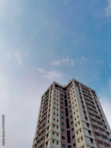 apartment building with sky © Zainul
