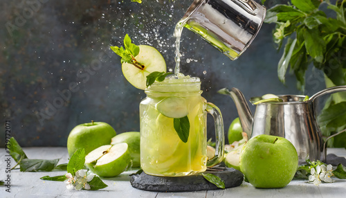 Green apple juice splash in jar and fresh apple fruit slices photo