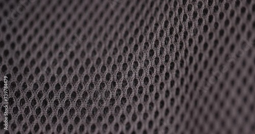 soft black ventilated mesh fabric with holes, black synthetic fabric for use in the manufacture of items photo