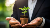 plant in businessman hand , green business