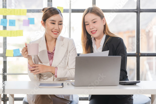 Portrait of success Asian business people working together in home office. Couple teamwork startup concept