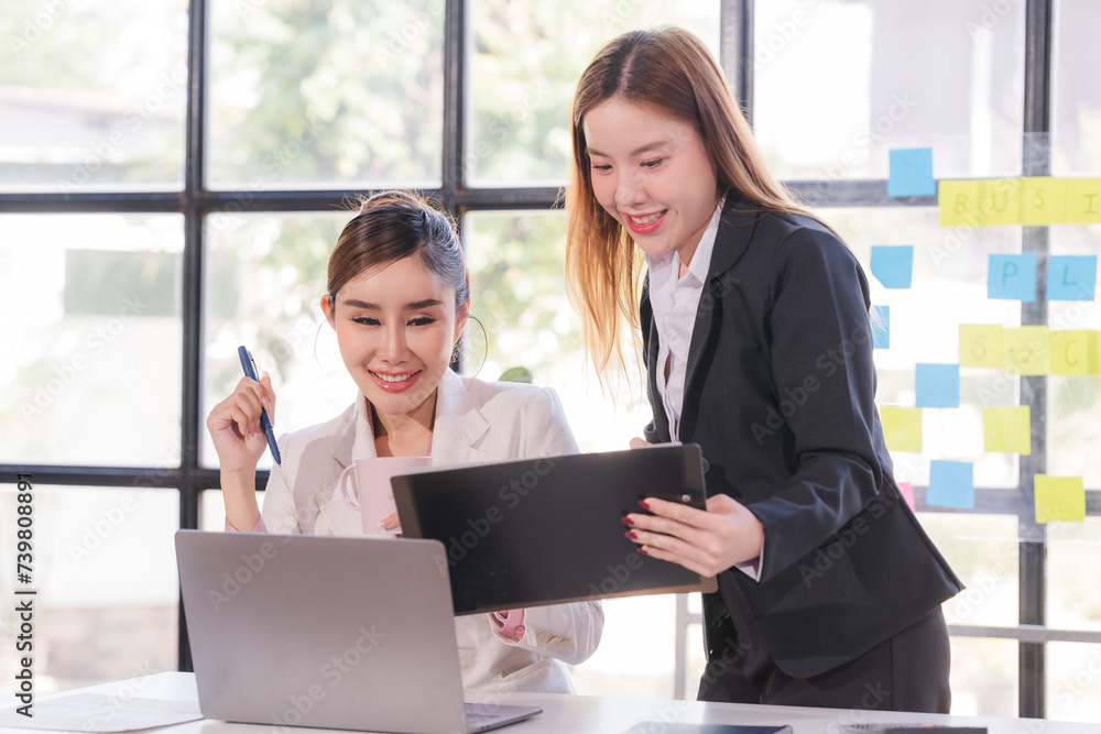 Portrait of success Asian business people working together in home office. Couple teamwork startup concept Portrait of success Asian business people working together in home office. Couple teamwork startup concept