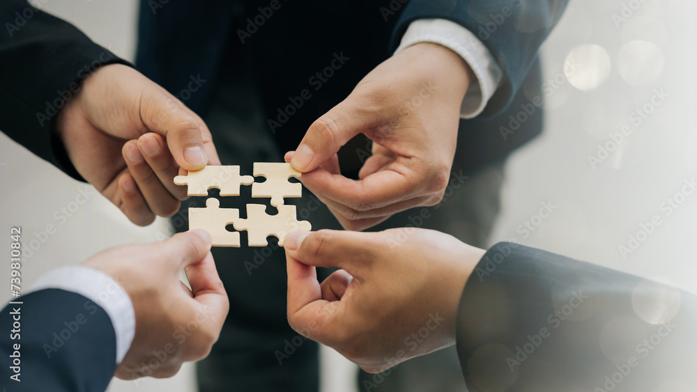 Concept of teamwork and partnership. The hands of business people join puzzle pieces together. Charity, volunteer. Unity, team business. success and strategy. togetherness Collaboration. banner Concept of teamwork and partnership. The hands of business people join puzzle pieces together. Charity, volunteer. Unity, team business. success and strategy. togetherness Collaboration. banner