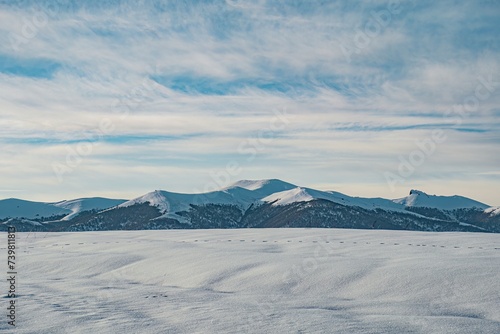 winter mountain landscape and cloudy sky © vardan