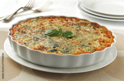 Quiche or chard pie with cheese and basil