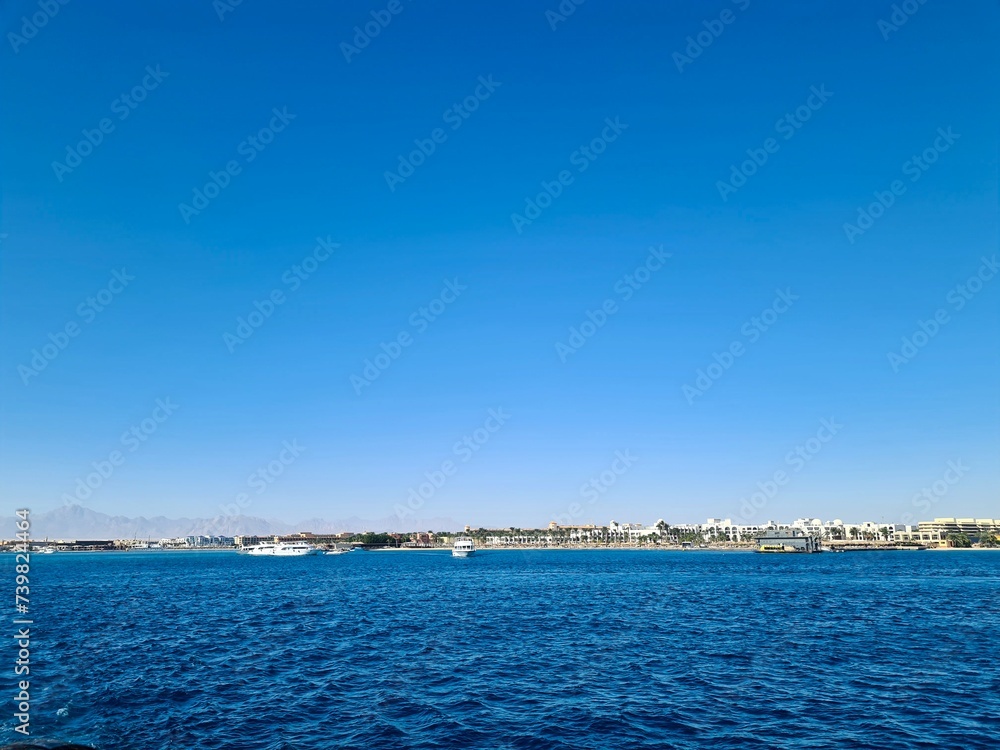 view of the sea and city from the beach