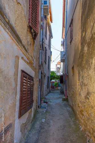 An alley in the Stari Grad historic centre of the coastal town of Novi Vinodolski, Primorje-Gorski Kotar County, Croatia © dragoncello