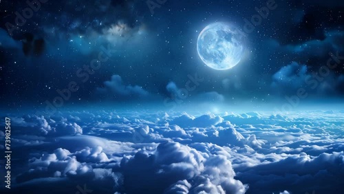 A mesmerizing glowing moon over a beautiful cloudscape in the night photo