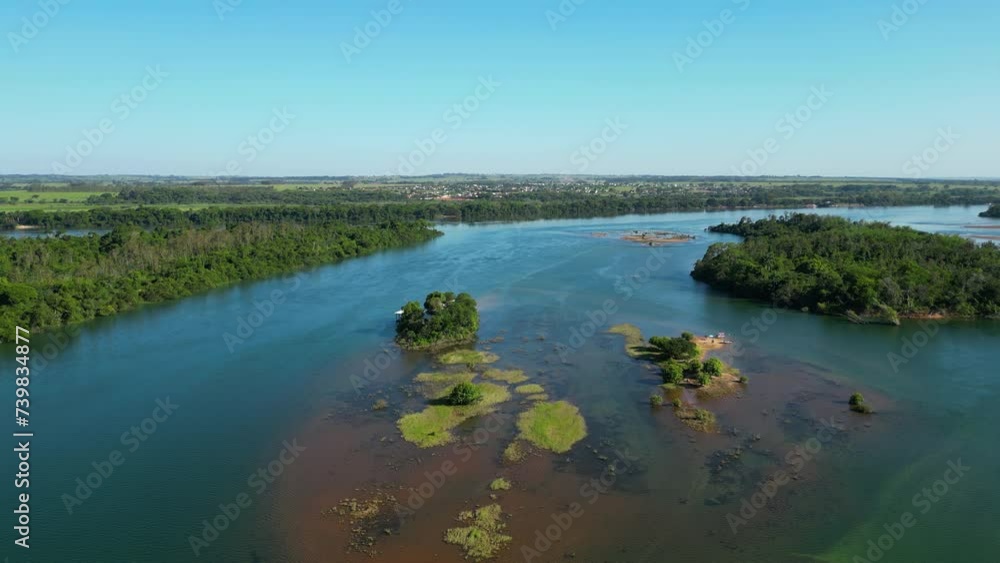 Aerial view around islands on Parana river, sunny day in Brazil, South America Aerial view around islands on Parana river, sunny day in Brazil, South America