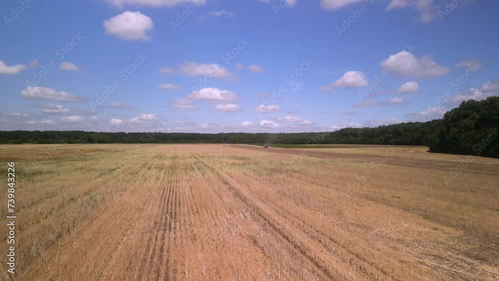 Tractor working on the field doing tillage Tractor working on the field doing tillage