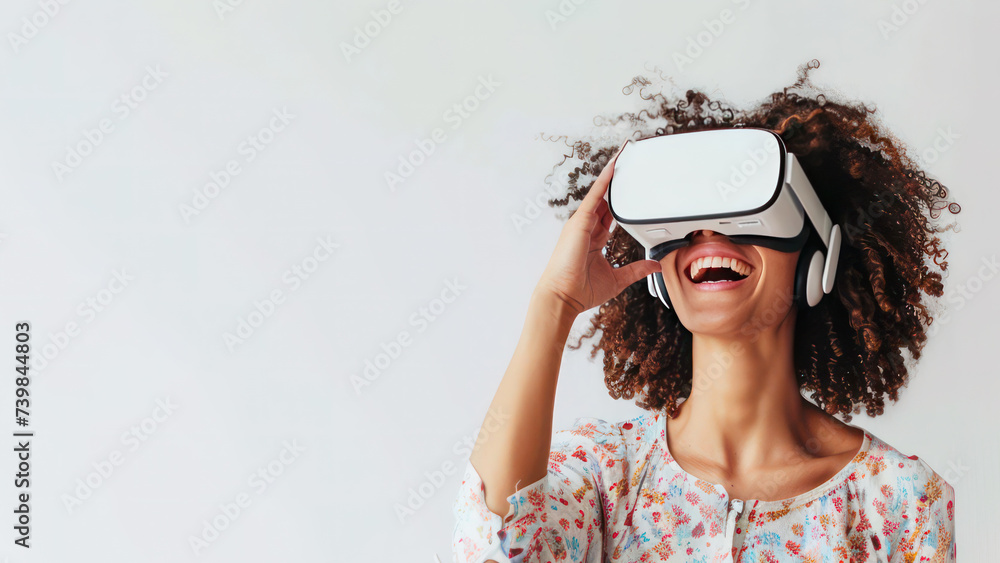 Young amuzed smiling woman wearing VR glasses
