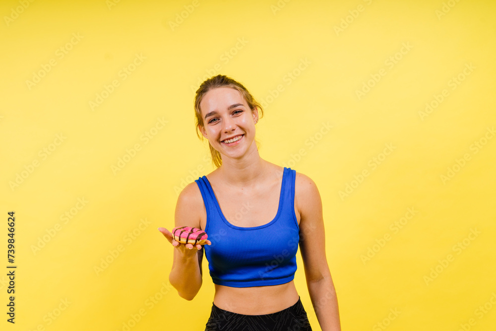 Portrait of beautiful female with chocolate donuts enjoying and looking at camera Portrait of beautiful female with chocolate donuts enjoying and looking at camera