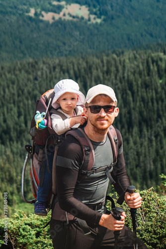 A man with a baby on the mountain