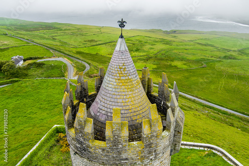 Doonagore Castle, round 16th-century tower house with a small walled enclosure located near the coastal village of Doolin in County Clare, Ireland. photo