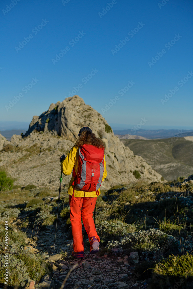 A woman hiking in the Costa Blanca mountains, Alicante, Spain - stock photo