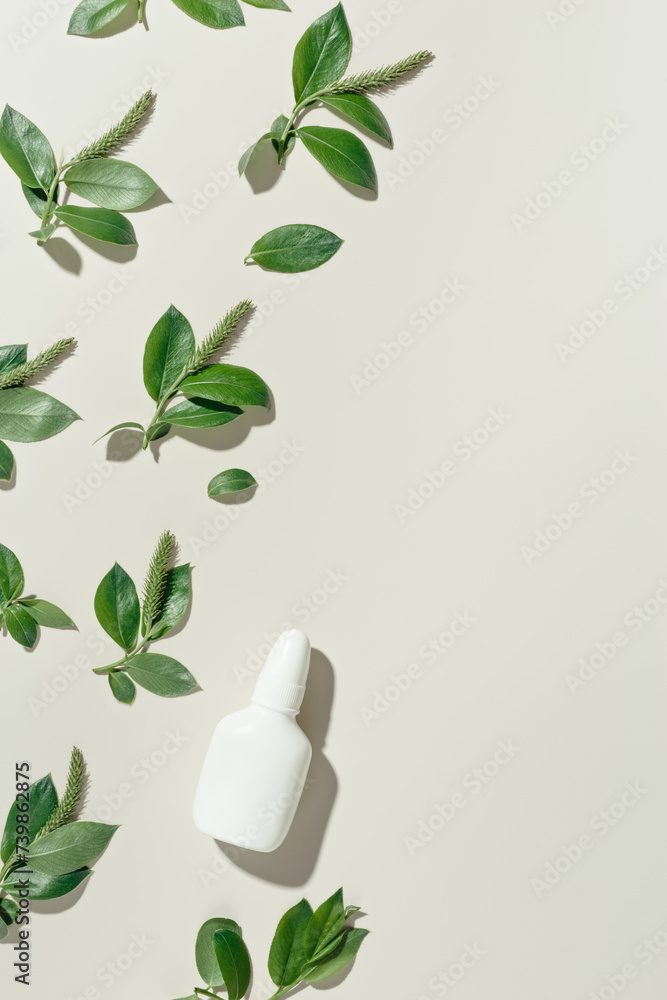 Seasonal spring allergies, green branches tree with blossoming catkins and mock up nasal spray bottle, Concept of treatment allergy to spring flowering. Antihistamine spray for nasal congestion Seasonal spring allergies, green branches tree with blossoming catkins and mock up nasal spray bottle, Concept of treatment allergy to spring flowering. Antihistamine spray for nasal congestion