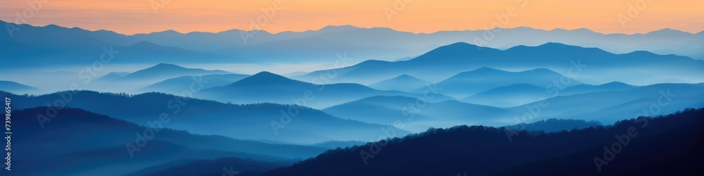 Obraz premium Great Smoky Mountain Ridge at Sunset: Stunning Blue and Orange Color Palette with Fog Over Country