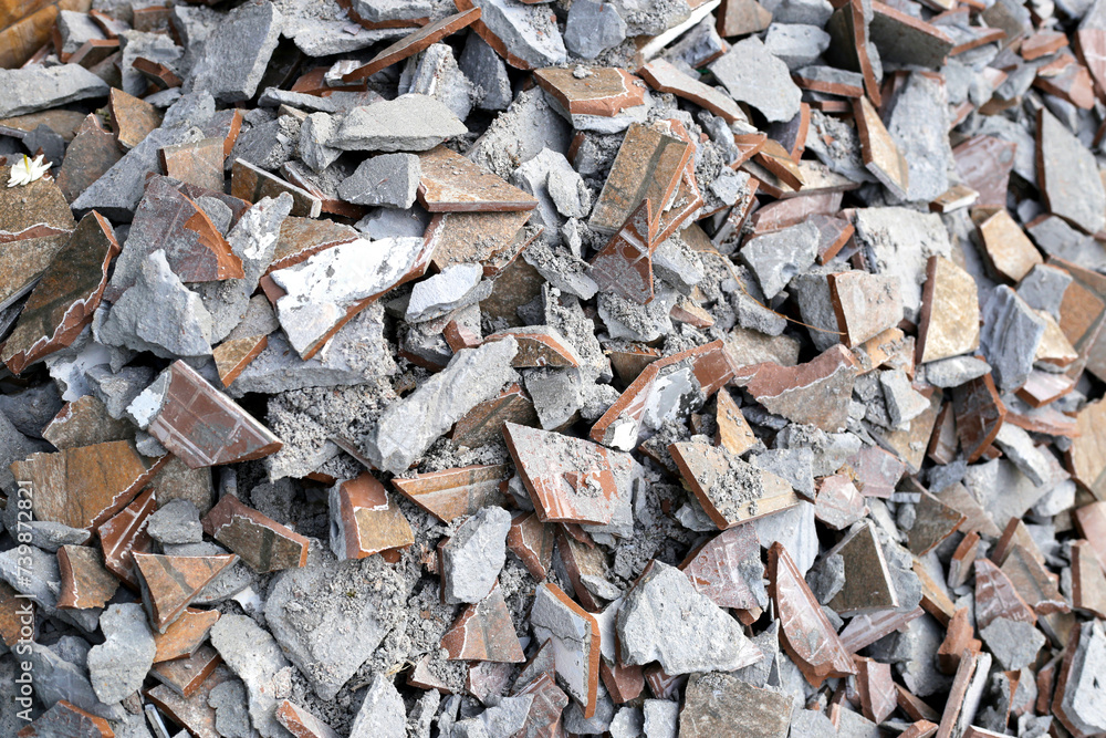 Piles of broken floor tiles from house renovations Piles of broken floor tiles from house renovations