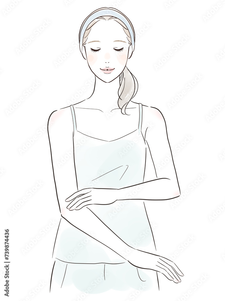 肌を触って微笑む女性 肌を触って微笑む女性