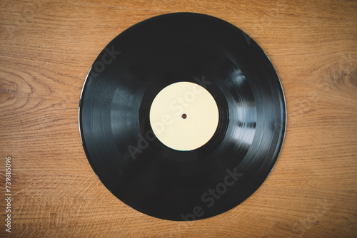 Close up of long play record on wooden background