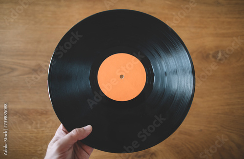 Close up of man hand holding long play record