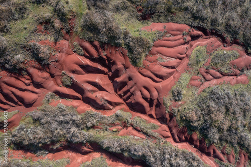Aerial view of a red sandstone canyon with river and trees © FRPhotos