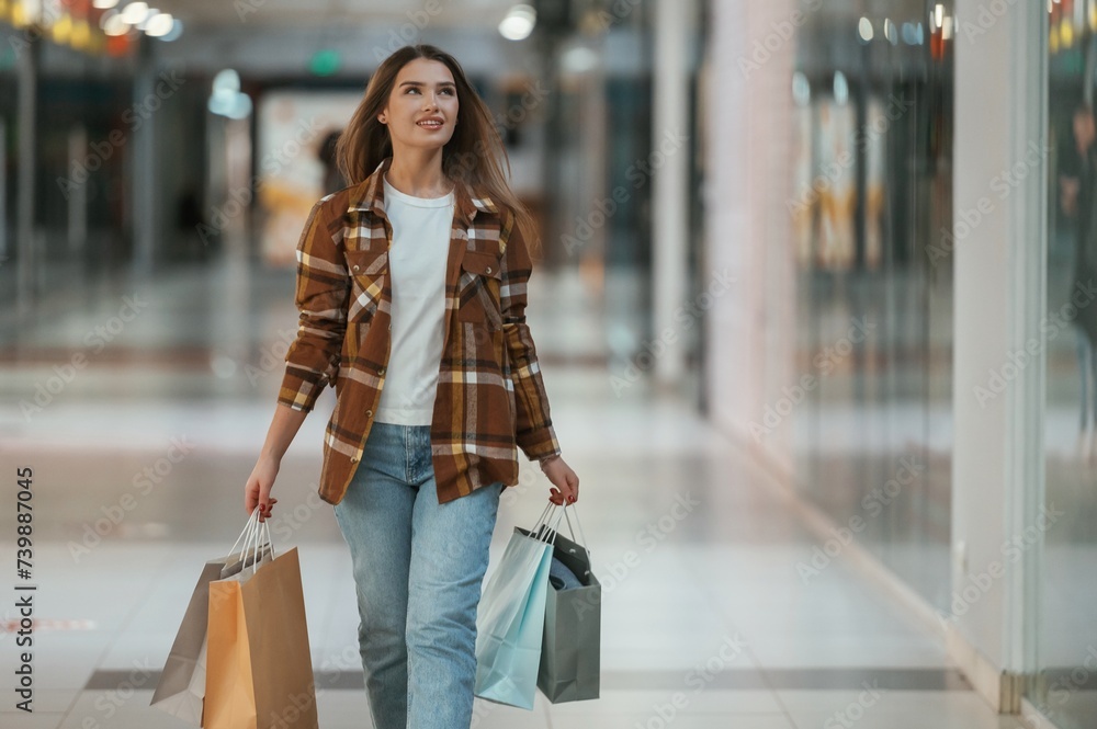 Front view. Woman is shopping in the supermarket Front view. Woman is shopping in the supermarket