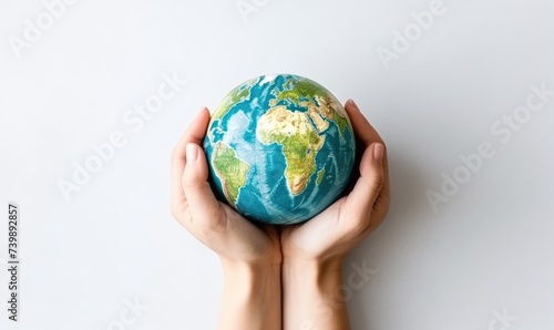 A Person Holding Small Globe