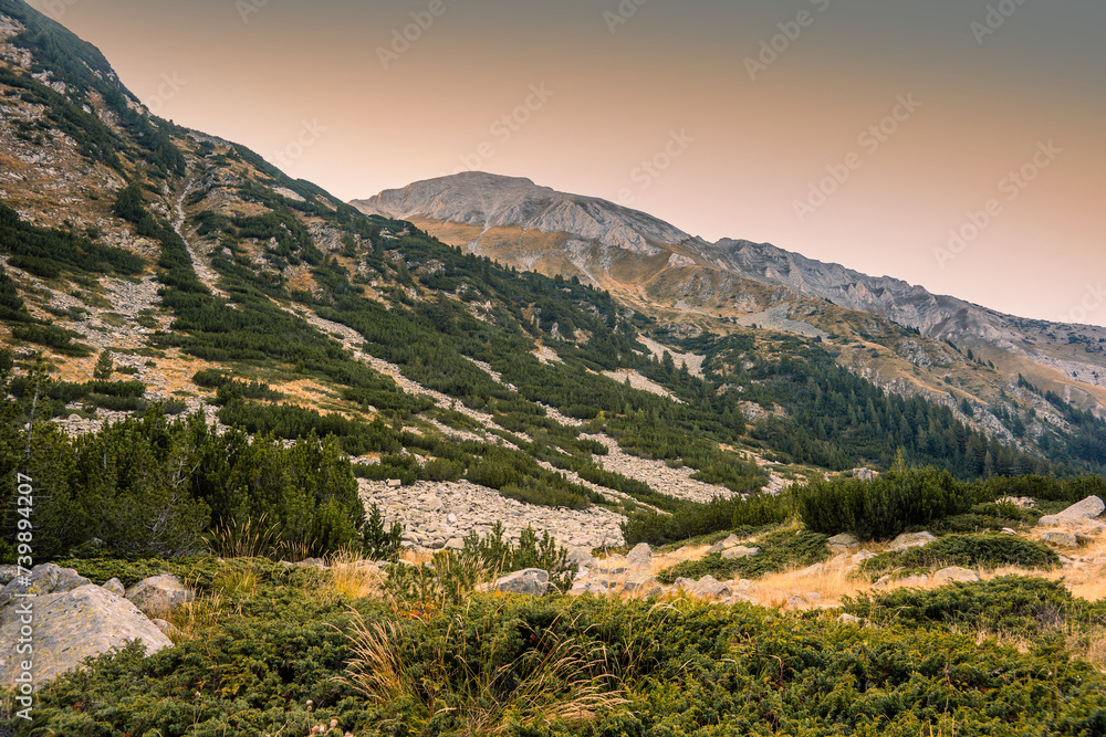 Mt. Khvoinati (on the left) and Vihren (on the right) slopes in the summer evening. View from the trekking route to the Fish (Ribno) lake.