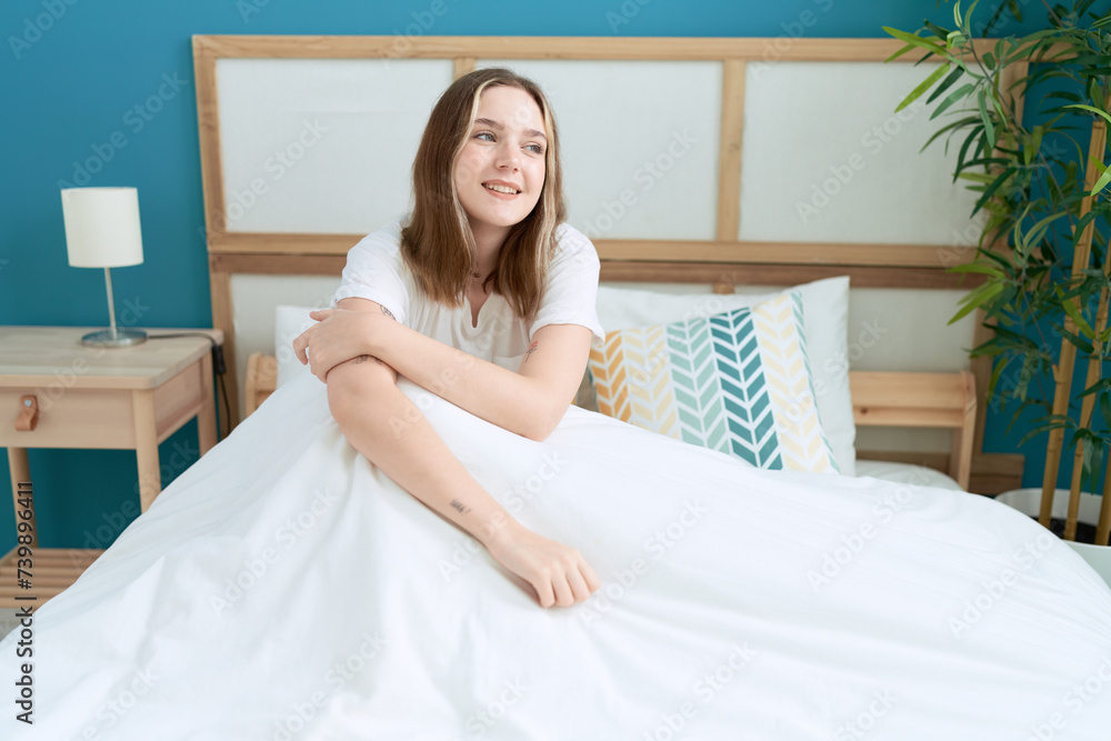 Young caucasian woman smiling confident sitting on bed at bedroom Young caucasian woman smiling confident sitting on bed at bedroom