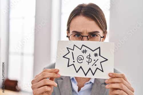 Young caucasian woman business worker holding onomatopeia banner shouting at office