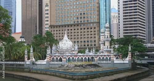 River of Life, Kuala Lumpur, Malaysia, Masjid Jamek, a historic mosque Kuala Lumpur. Masjid Jamek Sultan Abdul Samad Mosque at the confluence of two rivers in Kuala Lumpur. A city landmark. photo