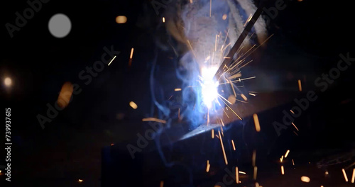 Welding of metal structures with sparks  close-up.