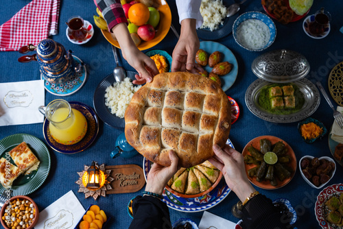 Ramadan Iftar Table. Muslim Family Having Dinner At Home. Iftar Table with Traditional Food. Fasting ends with Dates. Ramadan Feast Celebrations, Eid Mubarak Concept Uskudar Istanbul, Turkiye (Turkey)