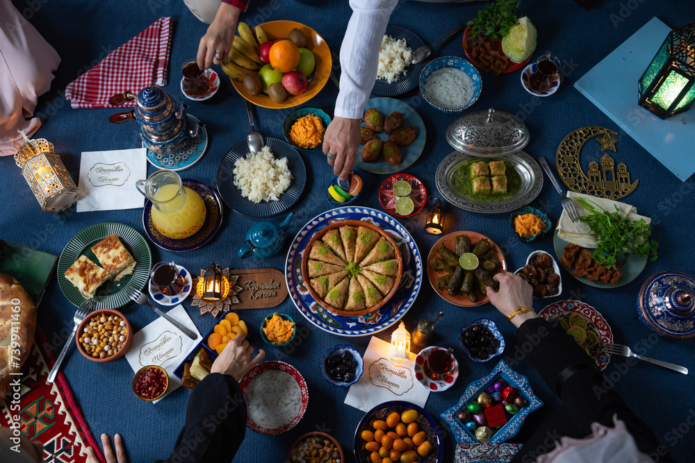 Ramadan Iftar Table. Muslim Family Having Dinner At Home. Iftar Table with Traditional Food. Fasting ends with Dates. Ramadan Feast Celebrations, Eid Mubarak Concept Uskudar Istanbul, Turkiye (Turkey) Ramadan Iftar Table. Muslim Family Having Dinner At Home. Iftar Table with Traditional Food. Fasting ends with Dates. Ramadan Feast Celebrations, Eid Mubarak Concept Uskudar Istanbul, Turkiye (Turkey)