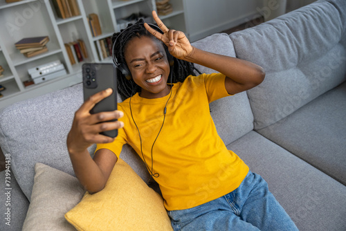 Young woman having a video call and smiling
