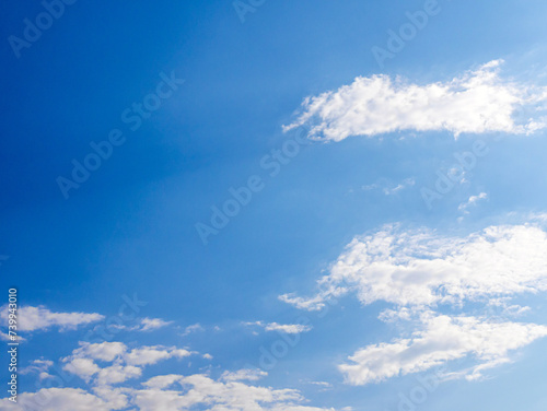 blue sky background with tiny white clouds