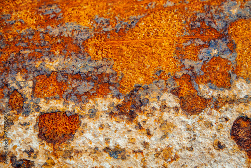 Eroded metallic texture, abstract rusty background. Corrosion spots on metal close-up. © Kate Stock