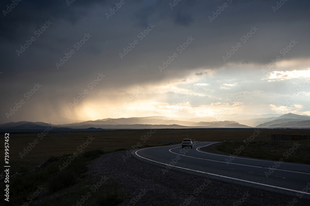 road mountains clouds storm sunlight sunset