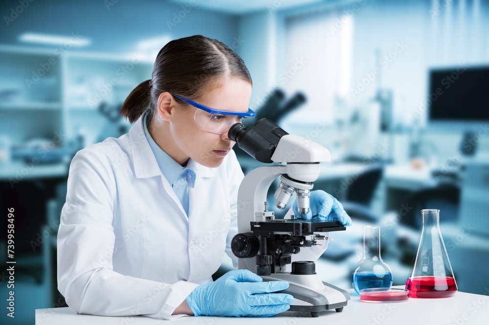 science student analyzing test in a laboratory. science student analyzing test in a laboratory.