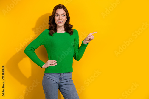 Photo of cheerful adorable woman share news black friday proposition empty space isolated on yellow color background