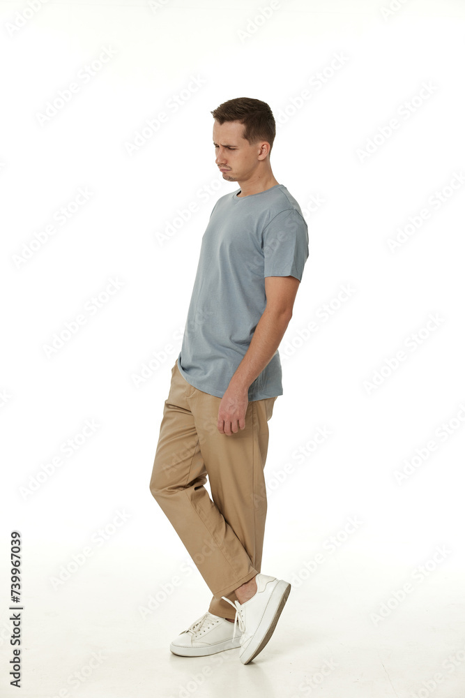 Naklejka premium offended frustrated young man on white background. sadness