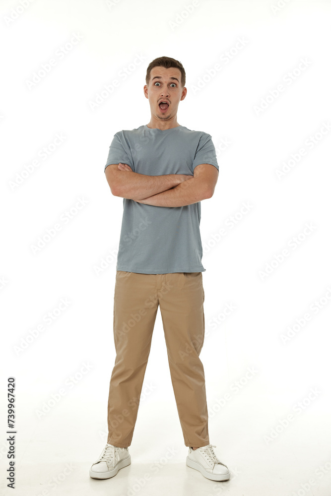 Fototapeta premium surprised guy looking at camera on white studio background