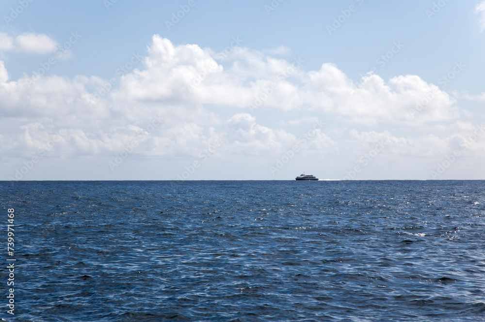 Obraz premium View of the sailing passenger boat on the sea