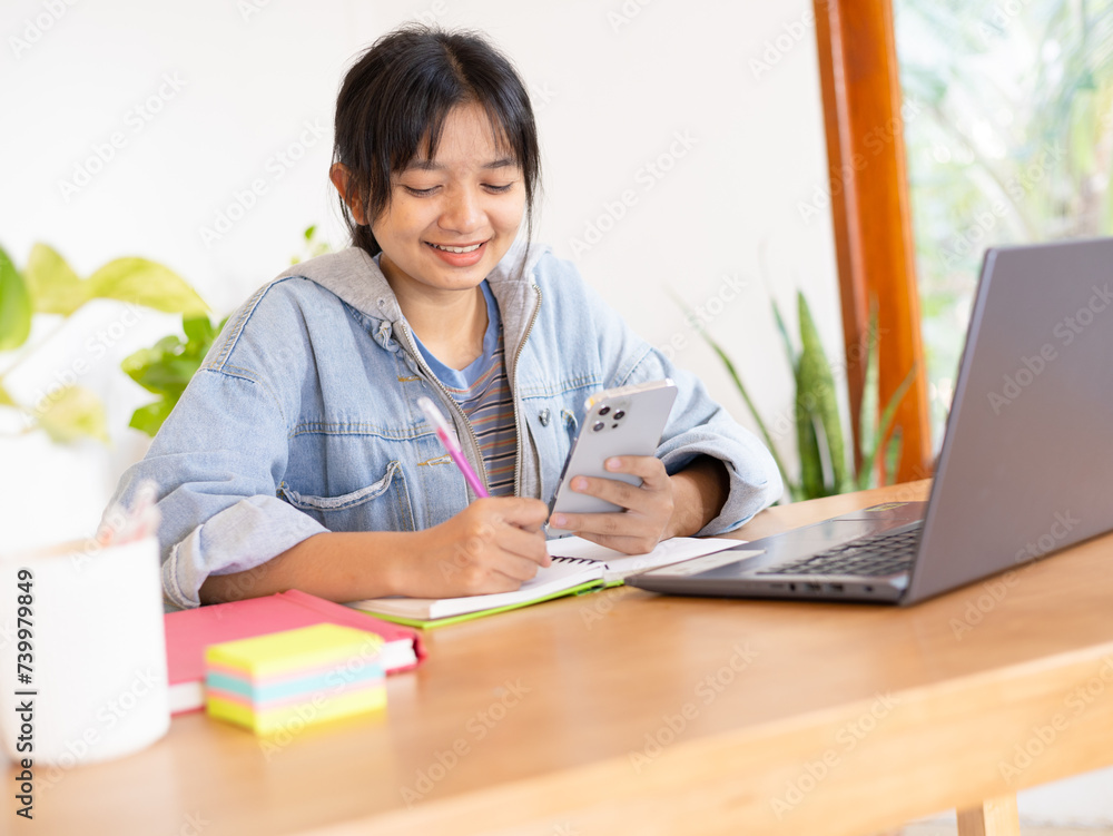 Happy student young girl studying at home, Asian girl. Happy student young girl studying at home, Asian girl.