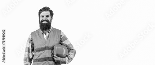Portrait of a professional heavy industry worker wearing uniform. Bearded man worker with beard in building helmet or hard hat. Portrait of a builder smiling. Man builders, industry.