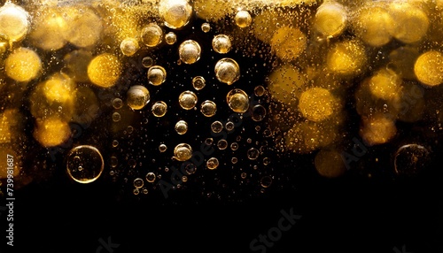 Golden bubbles water at black background, free space for your text