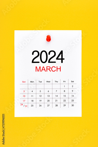 March 2024 calendar page with push pin on yellow.