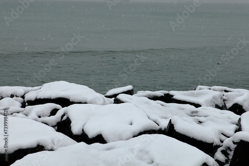 snow on the rocky beach in istanbul, marmara sea photo
