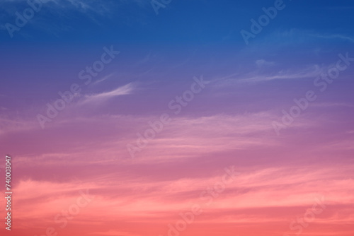 Early morning light sky before sunrise. Soft purple, pink and orange light on the horizon. Empty natural sky with colorful pastel tone colors for background. Vivid colors in modern mood. © namsai